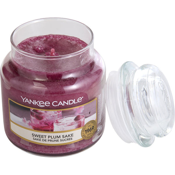YANKEE CANDLE by Yankee Candle (UNISEX) - SWEET PLUM SAKE SCENTED SMALL JAR 3.6 OZ